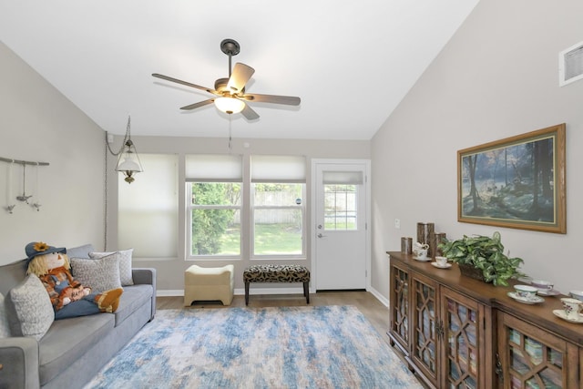 646 S Curran Rd, Round Lake, IL 60073 - living area with a ceiling fan, wood finished floors, baseboards, and lofted ceiling
