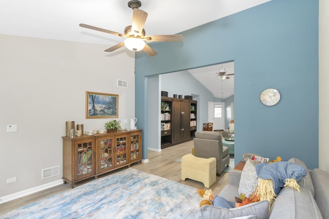 646 S Curran Rd, Round Lake, IL 60073 - living area with a ceiling fan, lofted ceiling, wood finished floors, and baseboards