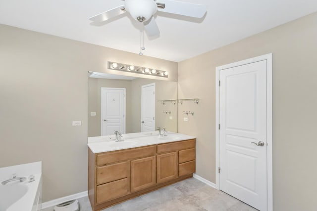 646 S Curran Rd, Round Lake, IL 60073 - bathroom with ceiling fan, double vanity, a garden tub, and baseboards