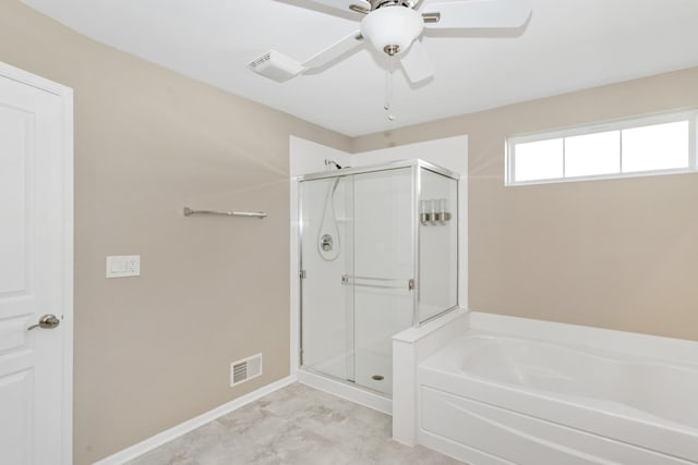 646 S Curran Rd, Round Lake, IL 60073 - bathroom with a shower stall, a bath, ceiling fan, and baseboards