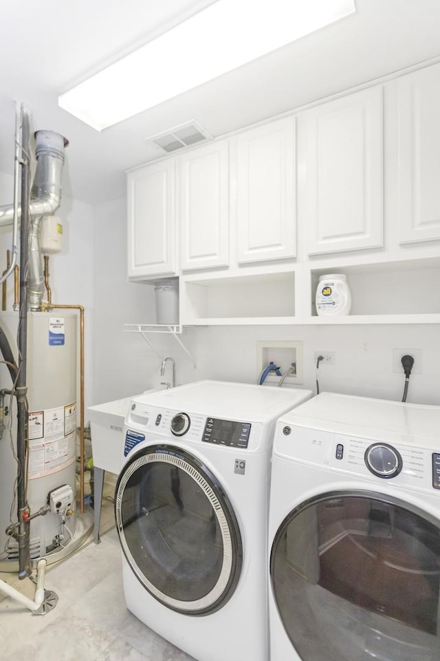 646 S Curran Rd, Round Lake, IL 60073 - laundry area featuring cabinet space, gas water heater, and washer and dryer