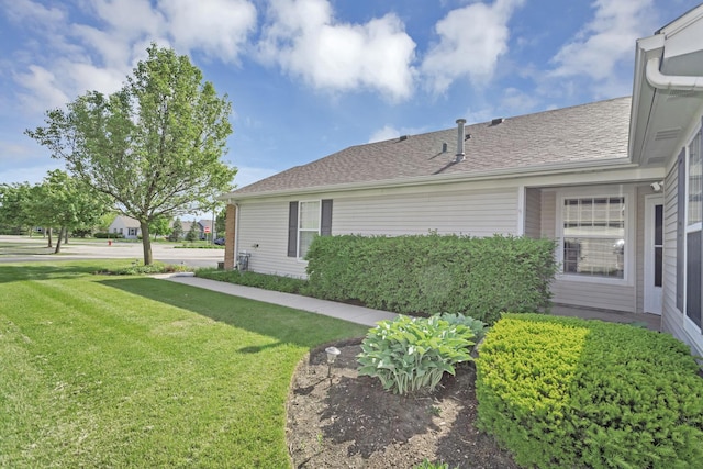 646 S Curran Rd, Round Lake, IL 60073 - view of side of property with a lawn and a shingled roof
