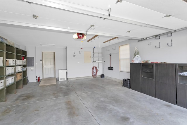 646 S Curran Rd, Round Lake, IL 60073 - garage with electric panel and a garage door opener