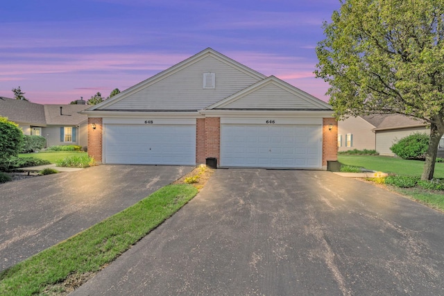 646 S Curran Rd, Round Lake, IL 60073 - view of front of house featuring brick siding and driveway