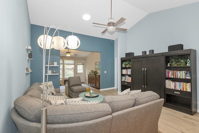 646 S Curran Rd, Round Lake, IL 60073 - living room featuring a ceiling fan, light wood-type flooring, and vaulted ceiling