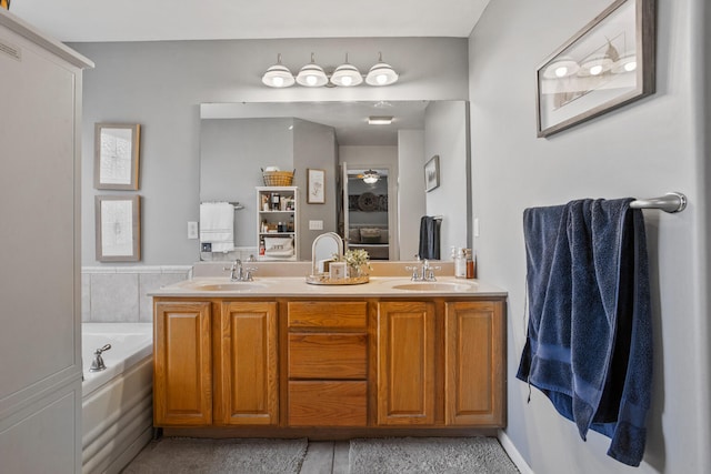 713 Sedgegrass Dr, Champaign, IL 61822 - ensuite bathroom with double vanity and a bath