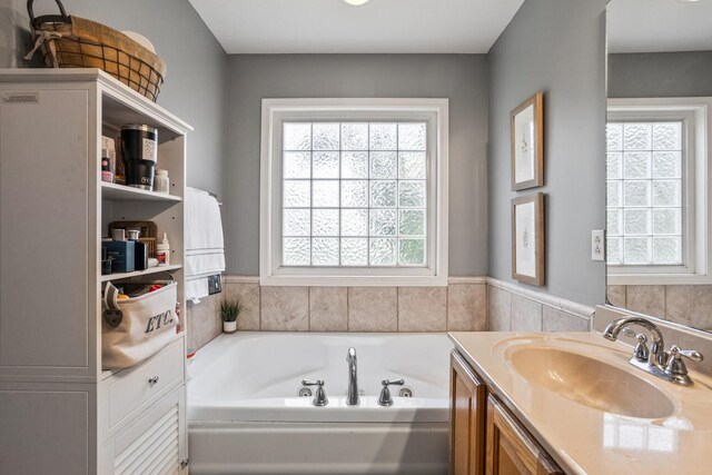 713 Sedgegrass Dr, Champaign, IL 61822 - bathroom with a whirlpool tub and vanity