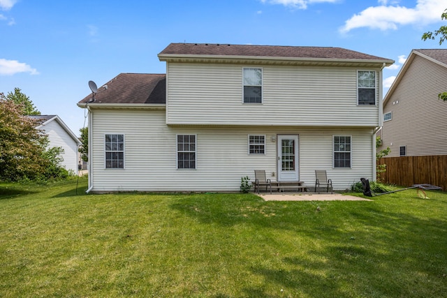 713 Sedgegrass Dr, Champaign, IL 61822 - back of property with a patio and roof with shingles