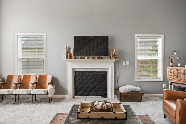 713 Sedgegrass Dr, Champaign, IL 61822 - living area with carpet, a high ceiling, and a tiled fireplace