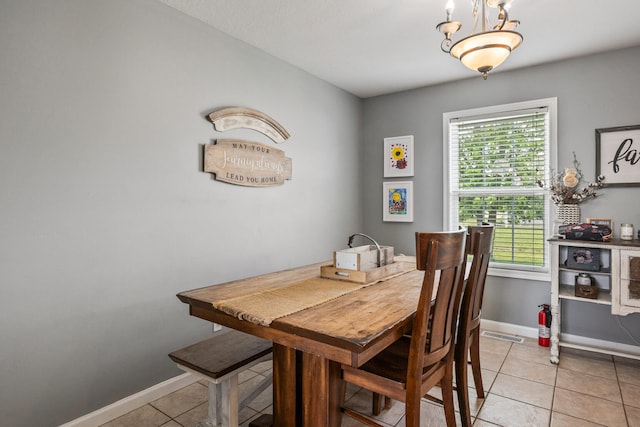 713 Sedgegrass Dr, Champaign, IL 61822 - dining room featuring light tile patterned floors and baseboards
