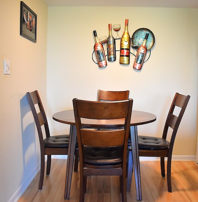2900 Maple Ave Unit 10E, Downers Grove, IL 60515 - dining area with wood finished floors and baseboards