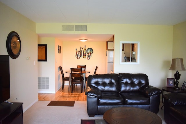 2900 Maple Ave Unit 10E, Downers Grove, IL 60515 - living room with wood finished floors and baseboards