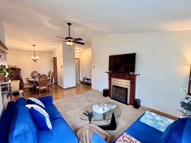 4316 W Shamrock Ln Unit 3C, Mchenry, IL 60050 - carpeted living area with ceiling fan, vaulted ceiling, a fireplace, and baseboards
