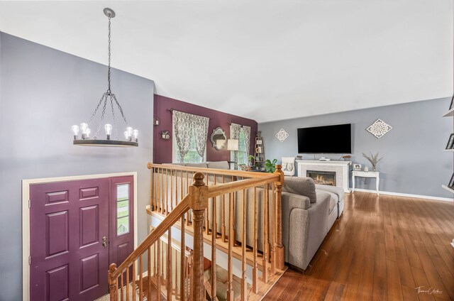 20005 S Mallory Dr, Frankfort, IL 60423 - living area featuring a chandelier, wood finished floors, a warm lit fireplace, and baseboards