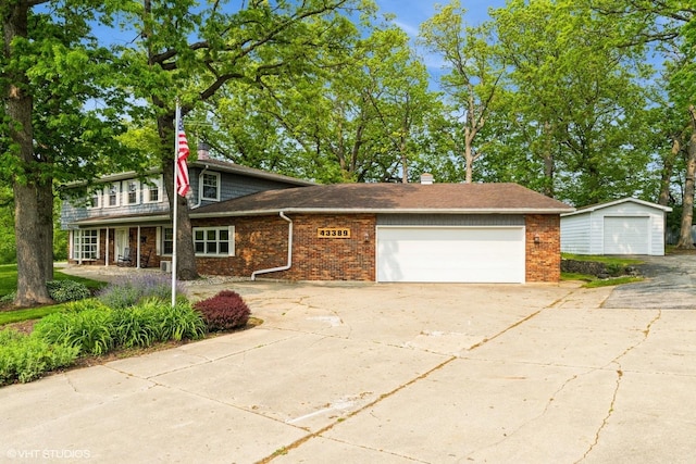 43389 N Oakcrest Ln N, Zion, IL 60099 - view of front facade with brick siding, an attached garage, and driveway