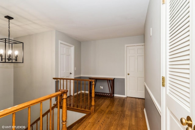 43389 N Oakcrest Ln N, Zion, IL 60099 - corridor with an upstairs landing, wood finished floors, a chandelier, and baseboards