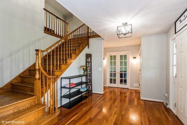 43389 N Oakcrest Ln N, Zion, IL 60099 - entrance foyer with wood finished floors, stairway, and baseboards