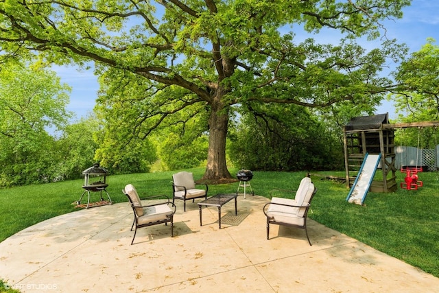 43389 N Oakcrest Ln N, Zion, IL 60099 - view of patio / terrace with a playground and an outdoor fire pit