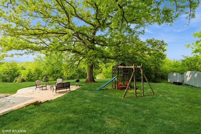43389 N Oakcrest Ln N, Zion, IL 60099 - view of grassy yard featuring a playground