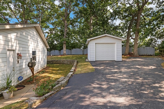 43389 N Oakcrest Ln N, Zion, IL 60099 - view of yard featuring a garage, an outbuilding, and driveway