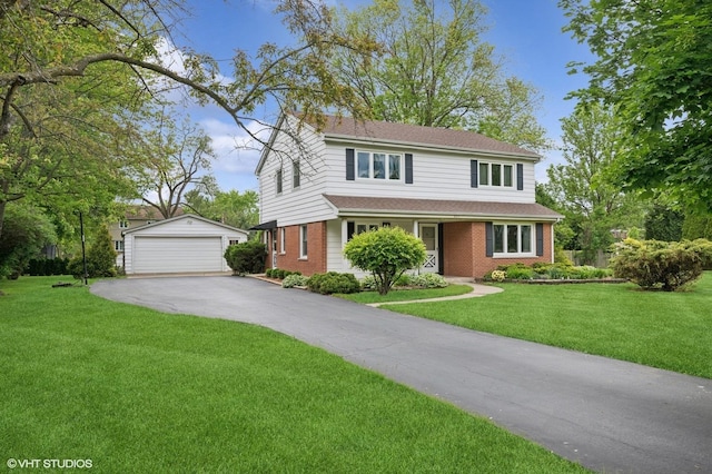 211 W Kenilworth Ave, Prospect Heights, IL 60070 - traditional home featuring an outdoor structure, brick siding, a detached garage, and a front lawn