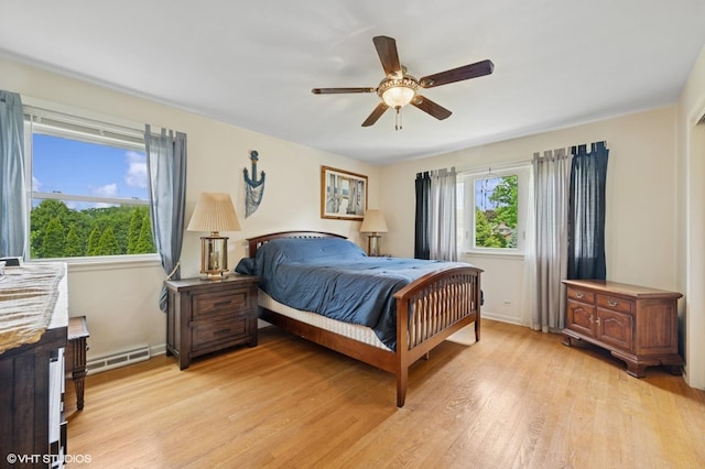 211 W Kenilworth Ave, Prospect Heights, IL 60070 - bedroom featuring light wood-style floors, baseboards, and a ceiling fan