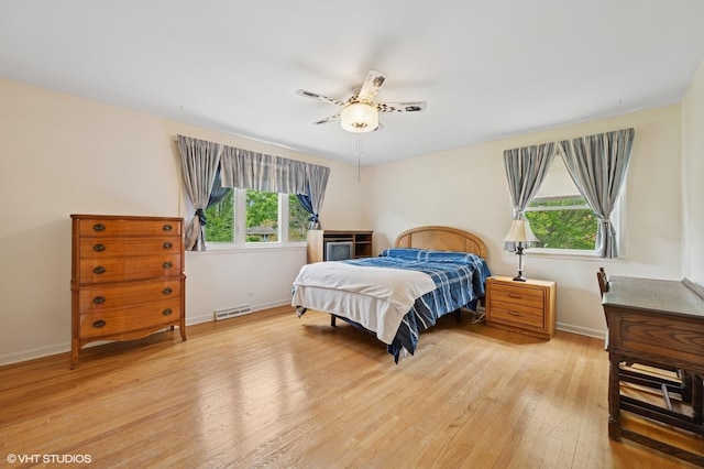 211 W Kenilworth Ave, Prospect Heights, IL 60070 - bedroom with light wood finished floors, baseboards, and ceiling fan
