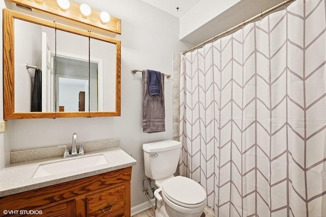 211 W Kenilworth Ave, Prospect Heights, IL 60070 - bathroom with vanity, toilet, curtained shower, and baseboards