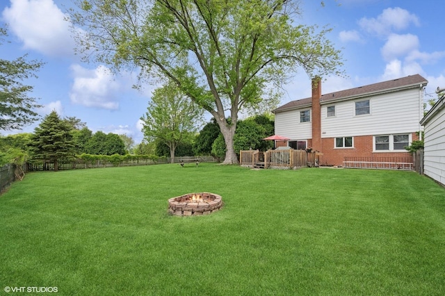 211 W Kenilworth Ave, Prospect Heights, IL 60070 - view of yard featuring an outdoor fire pit and a wooden deck