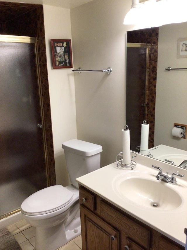 19533 Lake Shore Dr Unit 3N, Lynwood, IL 60411 - bathroom featuring toilet, vanity, a stall shower, and tile patterned floors