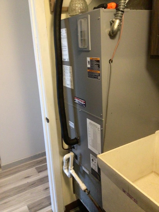 19533 Lake Shore Dr Unit 3N, Lynwood, IL 60411 - utility room with heating unit and a sink