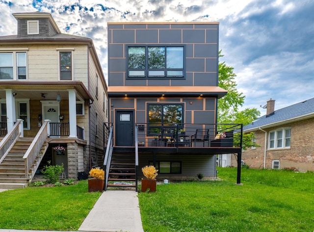 1009 Lathrop Ave, Forest Park, IL 60130 - view of front facade featuring stairs, a front yard, and a porch