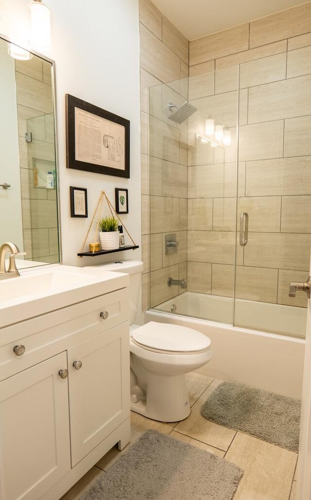 1009 Lathrop Ave, Forest Park, IL 60130 - bathroom featuring toilet, vanity, shower / tub combination, and tile patterned floors