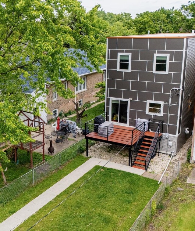 1009 Lathrop Ave, Forest Park, IL 60130 - back of property featuring a wooden deck and stairs