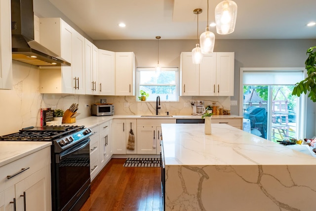 1009 Lathrop Ave, Forest Park, IL 60130 - kitchen featuring wall chimney exhaust hood, gas stove, a sink, light stone countertops, and dark wood-style flooring
