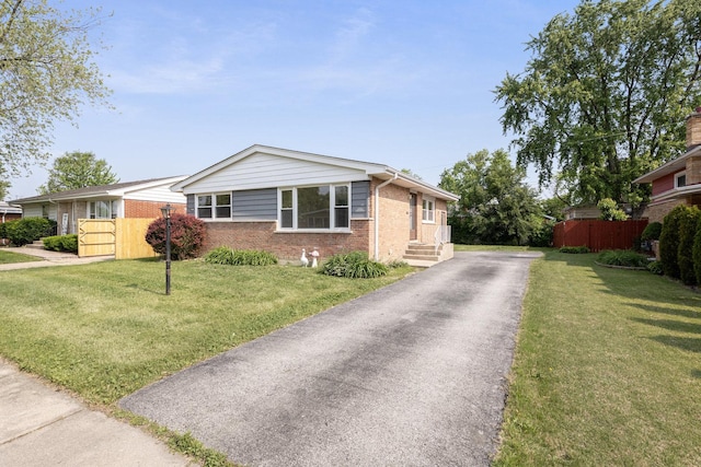 151 Amy St, Chicago Heights, IL 60411 - single story home featuring brick siding and asphalt driveway