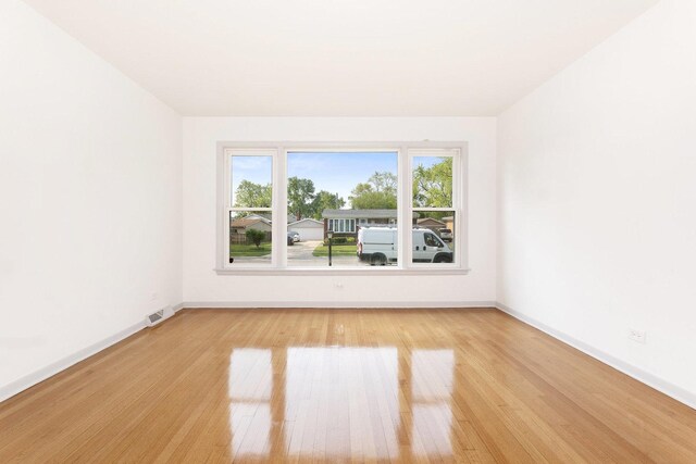 151 Amy St, Chicago Heights, IL 60411 - spare room featuring light wood-style floors and baseboards