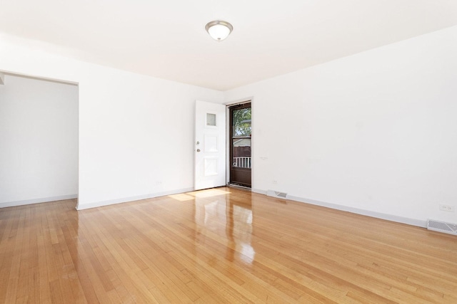 151 Amy St, Chicago Heights, IL 60411 - unfurnished room with light wood-style floors and baseboards