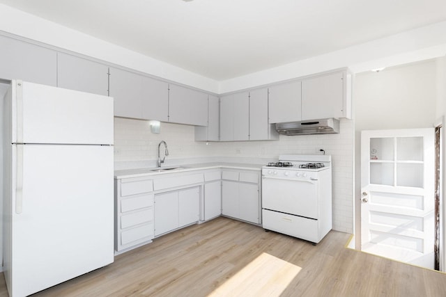 151 Amy St, Chicago Heights, IL 60411 - kitchen with white appliances, extractor fan, a sink, light wood-style floors, and light countertops