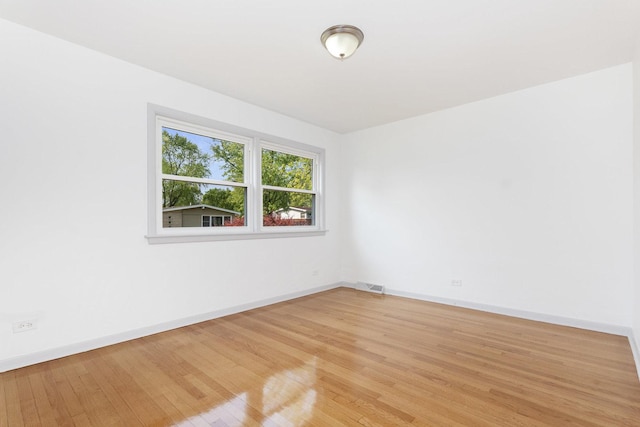 151 Amy St, Chicago Heights, IL 60411 - empty room featuring baseboards and light wood finished floors
