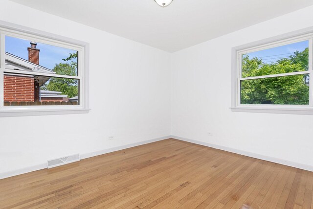 151 Amy St, Chicago Heights, IL 60411 - unfurnished room with baseboards and hardwood / wood-style floors