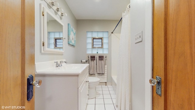 6250 W Holbrook St, Chicago, IL 60646 - bathroom featuring toilet, vanity, tile patterned floors, and shower / bath combo with shower curtain