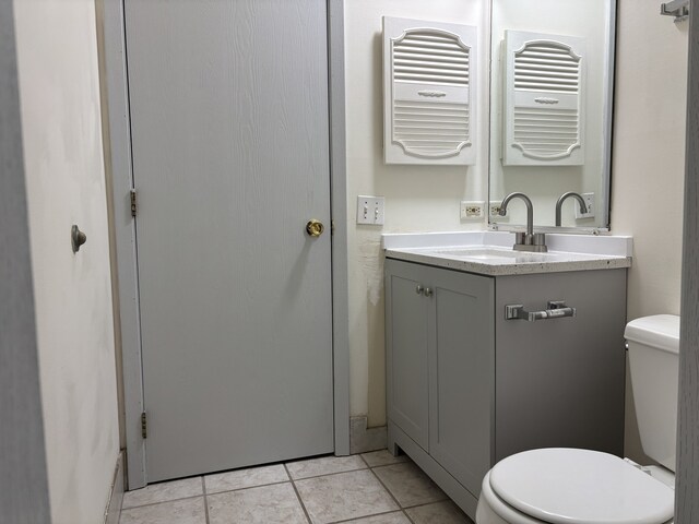 15 Echo Ct Unit 7, Vernon Hills, IL 60061 - bathroom with toilet, vanity, and tile patterned flooring
