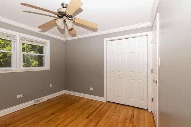 5940 W 88th Pl, Oak Lawn, IL 60453 - unfurnished bedroom with wood finished floors, ornamental molding, baseboards, a closet, and ceiling fan