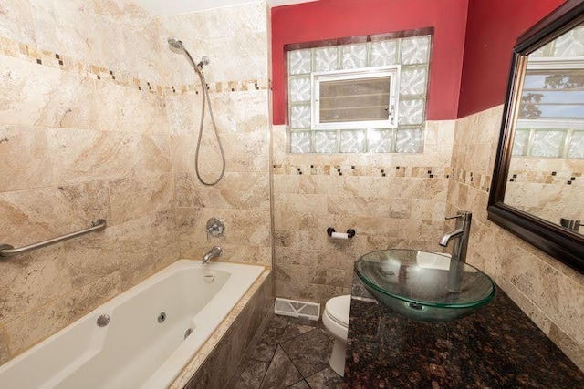 5940 W 88th Pl, Oak Lawn, IL 60453 - full bathroom featuring tile walls, tiled shower / bath, toilet, and a sink