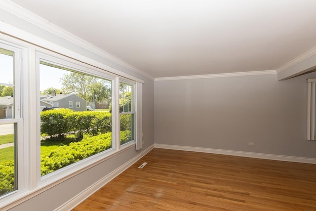 5940 W 88th Pl, Oak Lawn, IL 60453 - empty room featuring baseboards, light wood-style floors, and ornamental molding