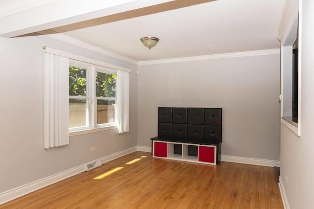 5940 W 88th Pl, Oak Lawn, IL 60453 - unfurnished room with wood finished floors, baseboards, and crown molding