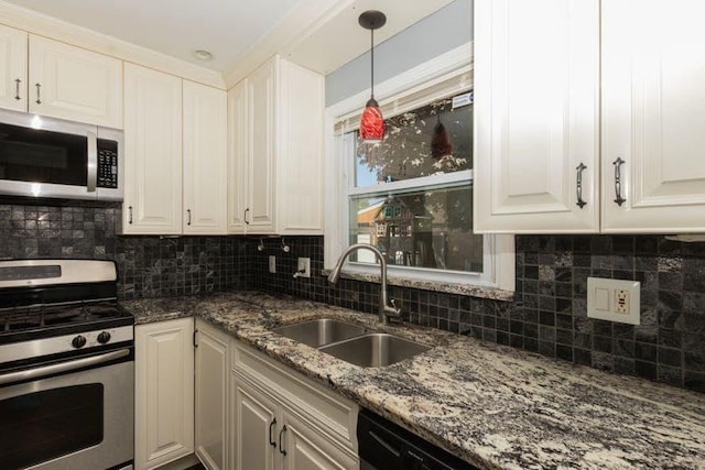 5940 W 88th Pl, Oak Lawn, IL 60453 - kitchen featuring appliances with stainless steel finishes, a sink, white cabinets, decorative light fixtures, and dark stone counters