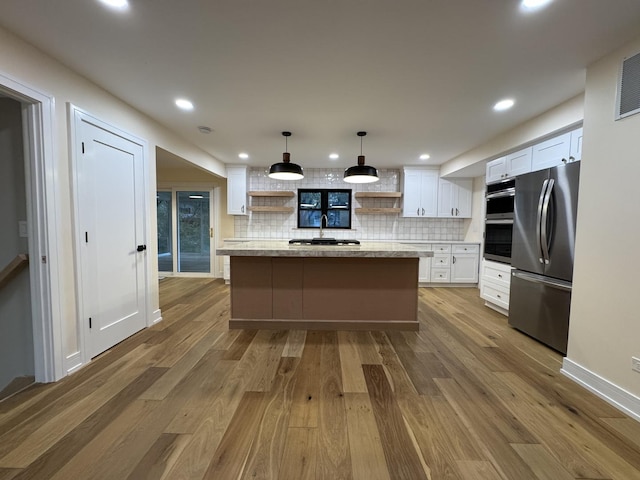 6013 Perry Dr, Woodridge, IL 60517 - kitchen with stainless steel appliances, open shelves, tasteful backsplash, white cabinets, and recessed lighting