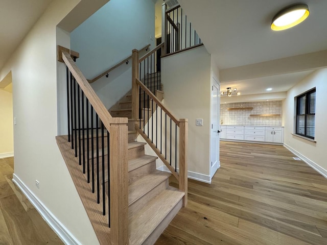 6013 Perry Dr, Woodridge, IL 60517 - stairs featuring wood finished floors, baseboards, and recessed lighting